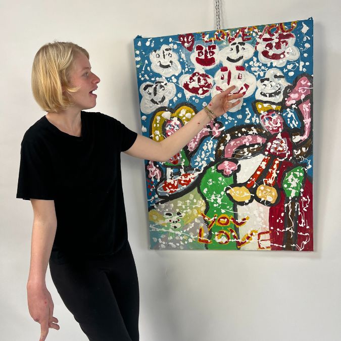 Clara Woods showing her artwork