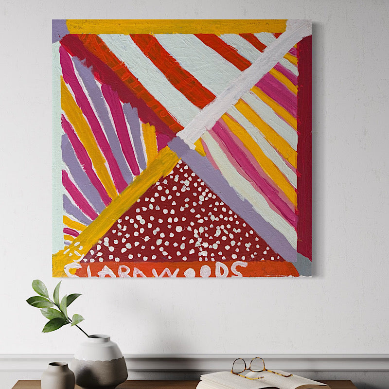 Abstract painting with colorful geometric design on a white wall. Artwork named Legacy by Clara Woods!
