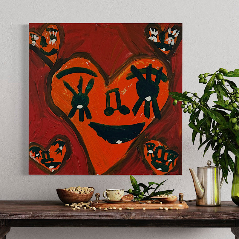 Abstract painting of a heart with musical notes on a wall above a wooden table with decorative items. Artwork Broken by Clara Woods