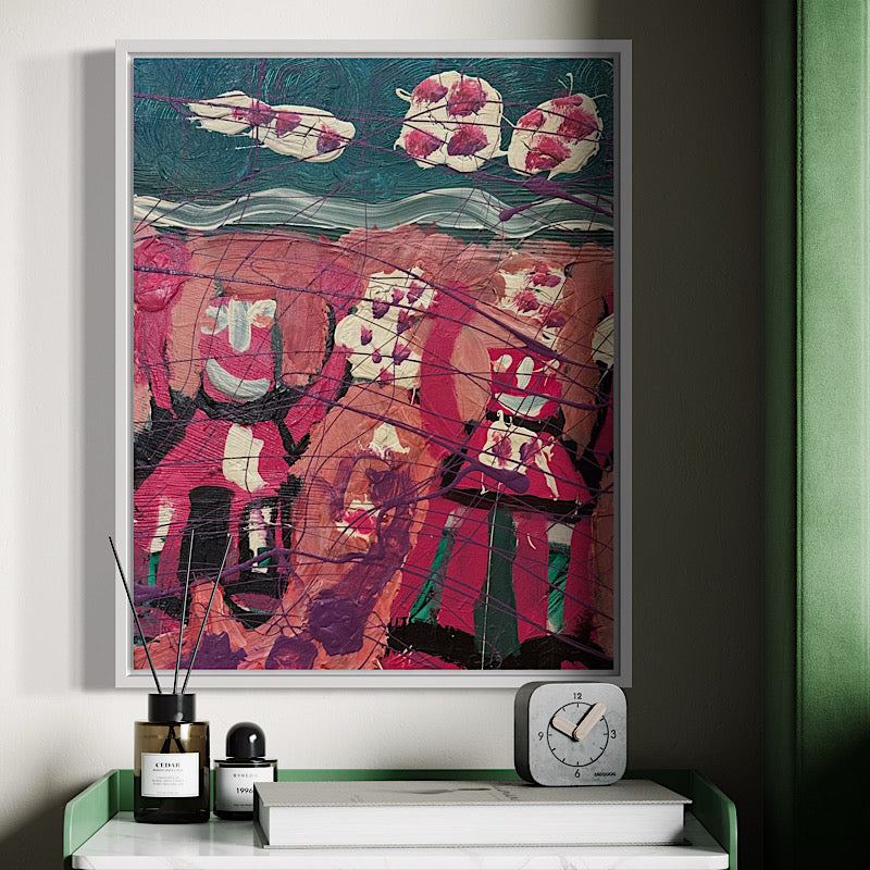 Abstract artwork in a white frame on a wall above a shelf with decorative items.