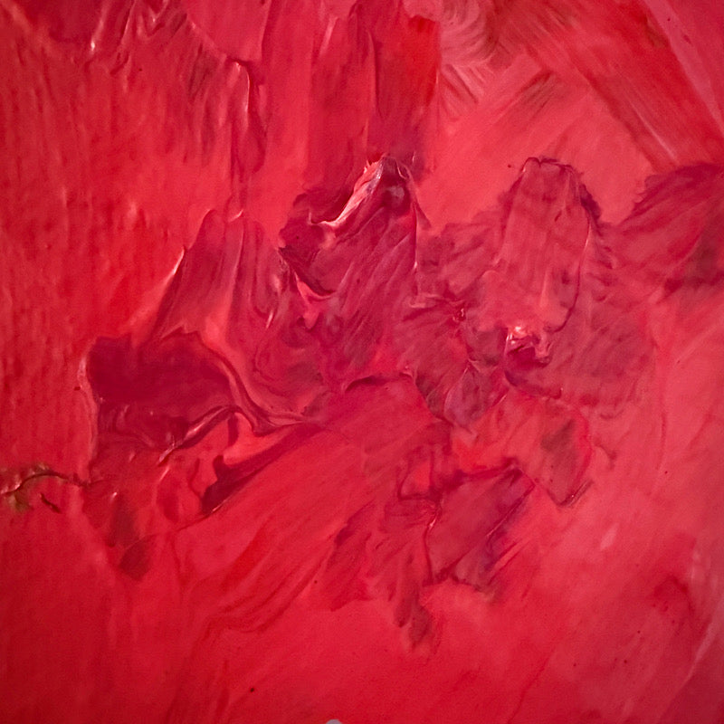 Little Mars original painting by Clara Woods hanging on white paneled wall, 12x12 in, red planet with cream halo on dark background, styled with coastal decor