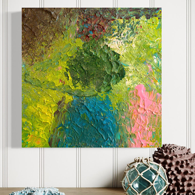 Clara Woods lying on the beach sand smiling behind Little Ocean 04, ocean waves in background, full canvas showing vibrant green, chartreuse and pink impasto painting