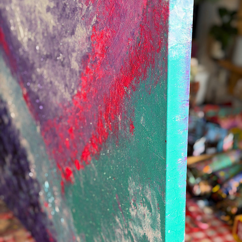 Pacific, Original by Clara Woods — full painting displayed on a warm beige wall above a wooden sideboard with ceramic vases, showing Clara's heart signature in the lower right corner
