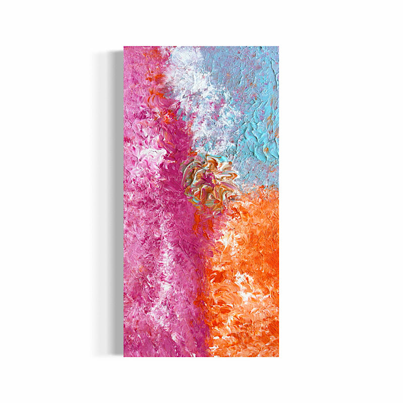 Beach Rose, Original by Clara Woods — Timothy laughing with joy at the beach, holding the Beach Rose painting upright in the sand, blue sky and ocean waves behind him