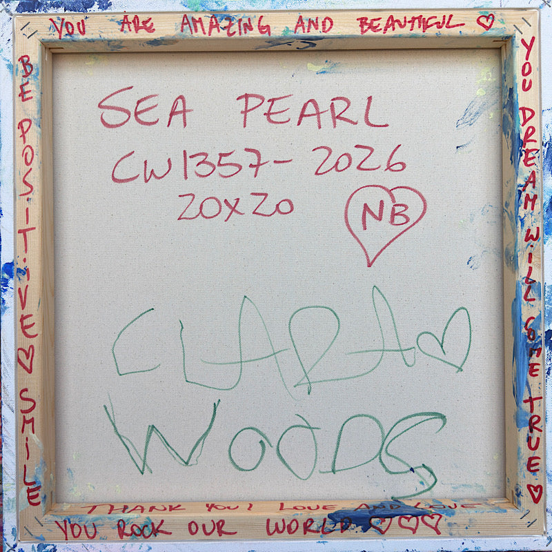 Sea Pearl, Original by Clara Woods — displayed on a white wall in a bright Scandinavian living room with a white sofa, round pendant lamp and large window with city view