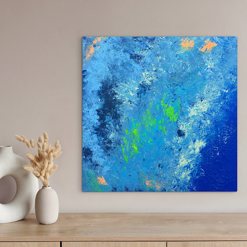 Sea Pearl, Original by Clara Woods — side view of the canvas in the studio on a checkered tablecloth, showing the depth of the cobalt blue painted edges and layered acrylic paint