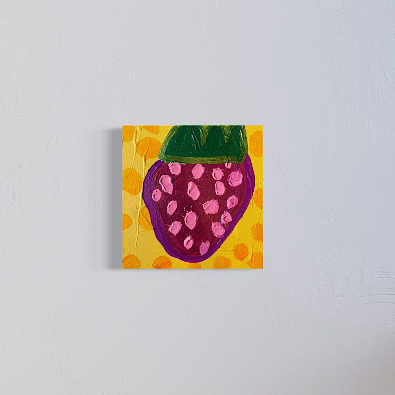 Little Strawberry original by Clara Woods, 2026, 12 x 12 in acrylic on canvas, pink-seeded fruit on yellow, shown on a wall