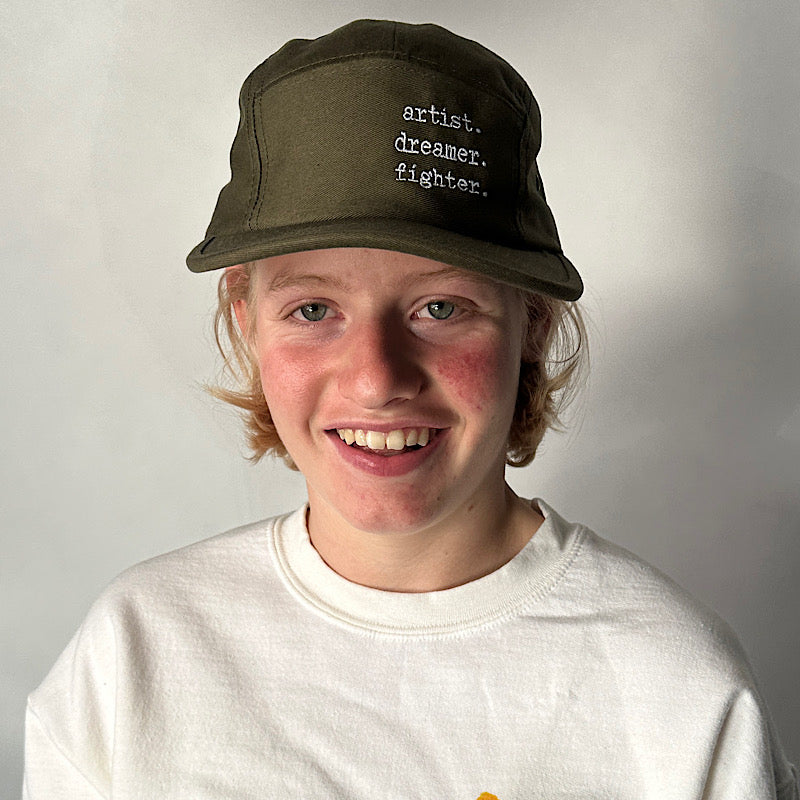 Artist. Dreamer. Figther. Hat