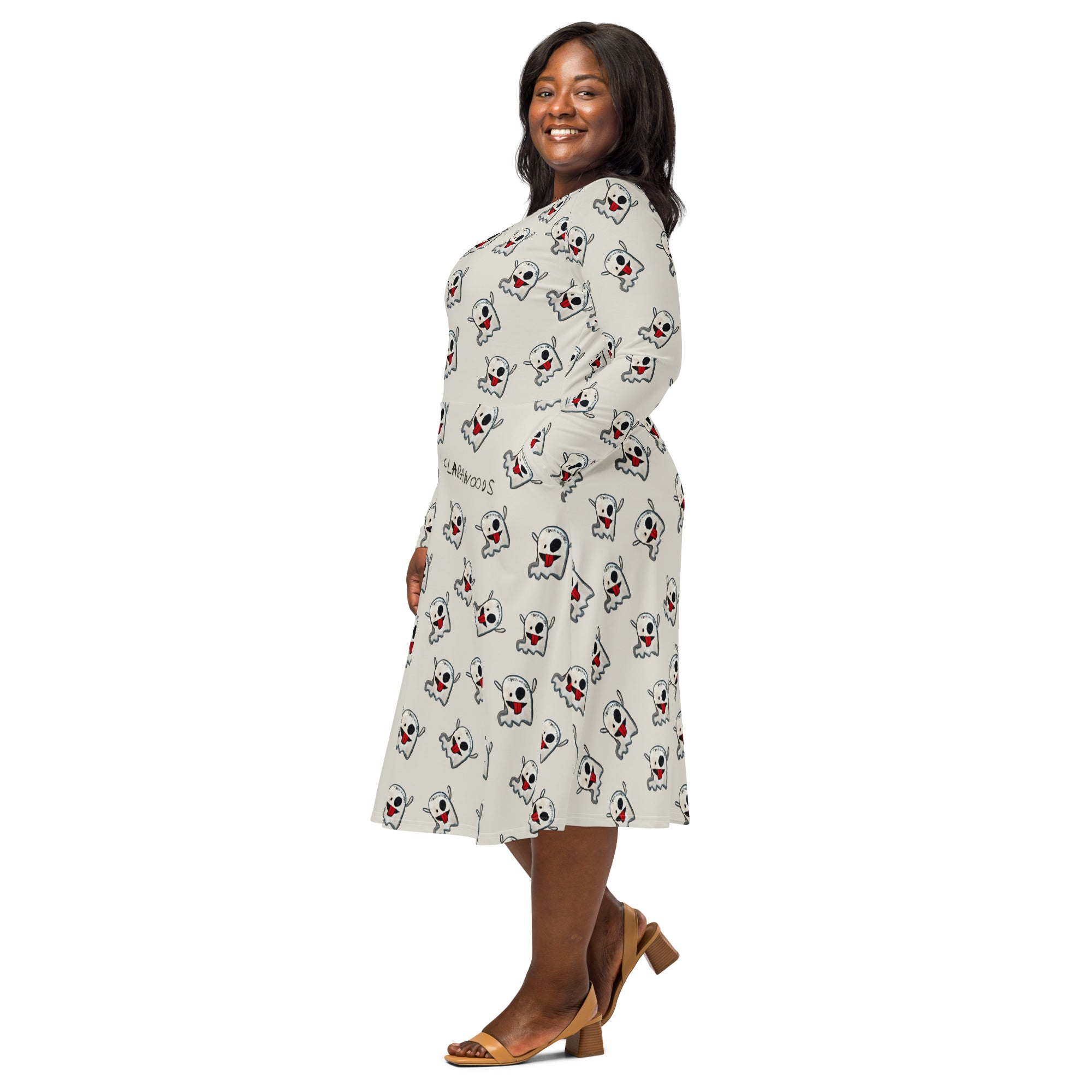 Woman wearing a patterned dress on a white background